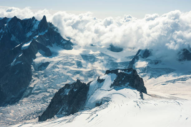 Mont Blanc experience Beautiful blue morning landscape with clouds over alps in Mont Blanc massif from Aiguille du Midi 3842m, Chamonix, France leisure activity french culture sport high angle view stock pictures, royalty-free photos & images