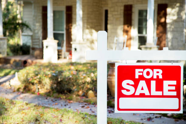 istock Home for sale with real estate sign.  Front yard. 1290923934