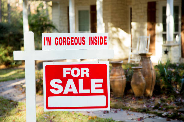 istock Home for sale with real estate sign.  Front yard. 1290923936