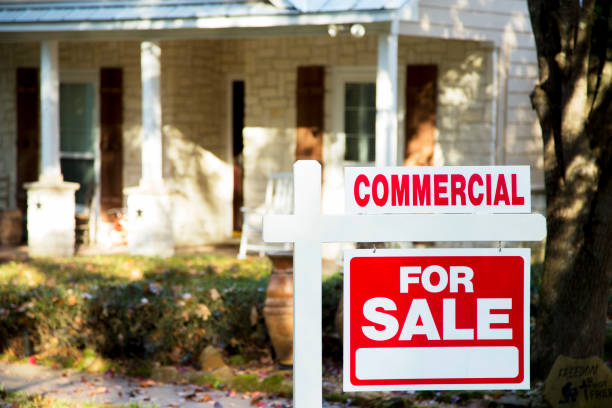 istock Home for sale with real estate sign.  Front yard. 1290924472