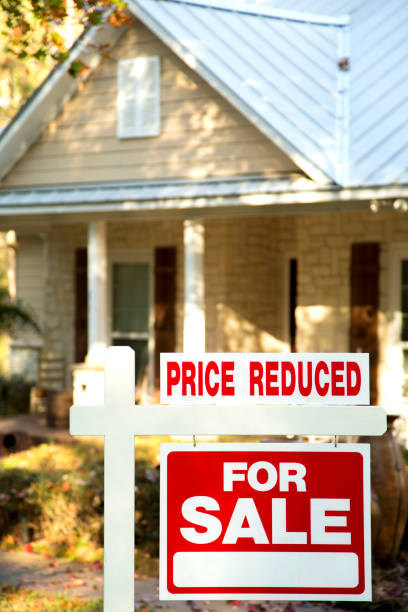 istock Home for sale with real estate sign.  Front yard. 1290924473