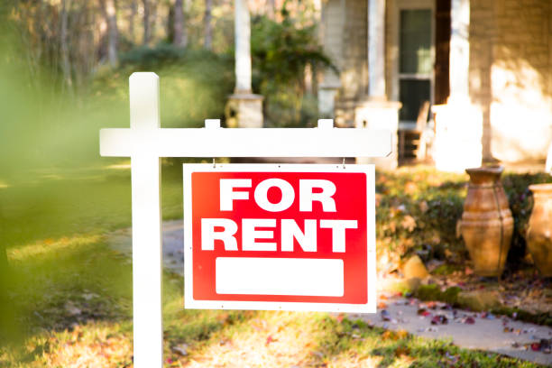 istock Home for sale with real estate sign.  Front yard. 1290924509