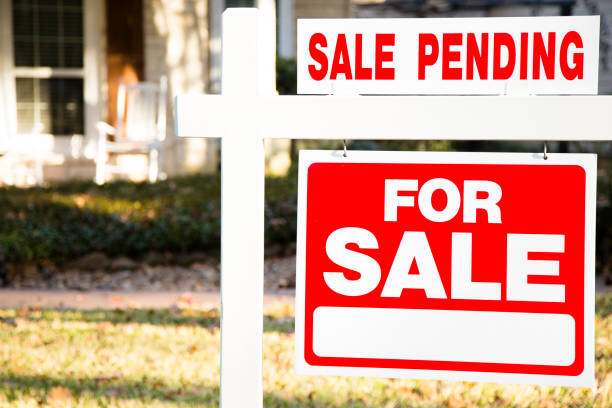 istock Home for sale with real estate sign.  Front yard. 1290924538