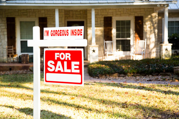 istock Home for sale with real estate sign.  Front yard. 1290924553