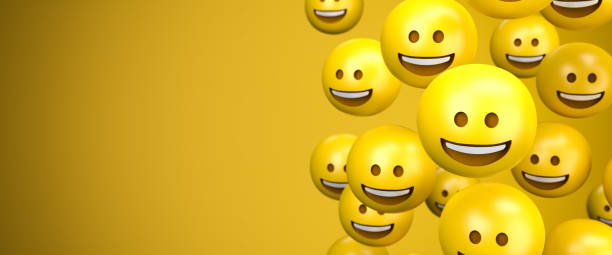 istock 3d render of a large group of broad smile emoji smileys. Copy space - Web banner size. 1290925475