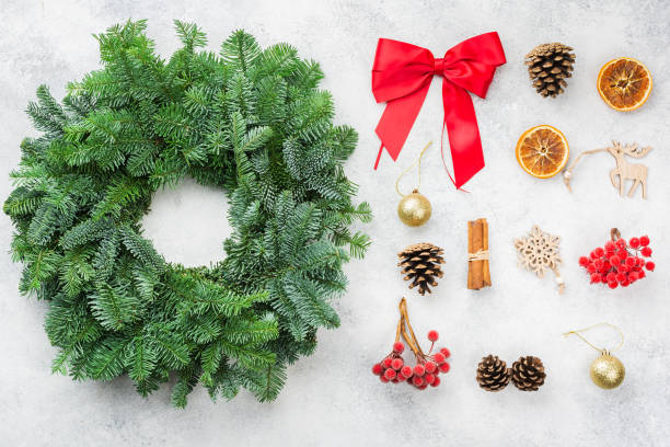 istock Handmade Christmas wreath on the white table 1290929858