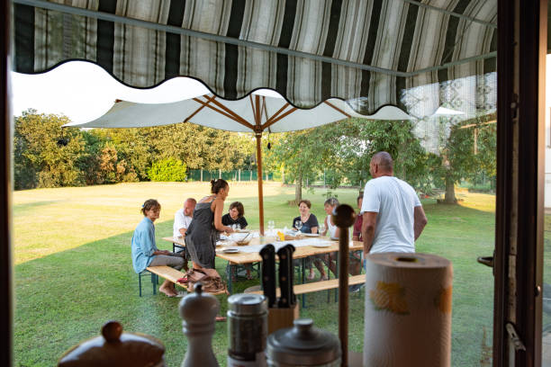 istock View From Indoors on Family Preparing For Picnic 1290933008