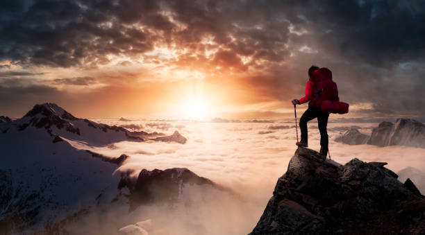 istock Girl Backpacker on top of a Mountain Peak. 1290935674