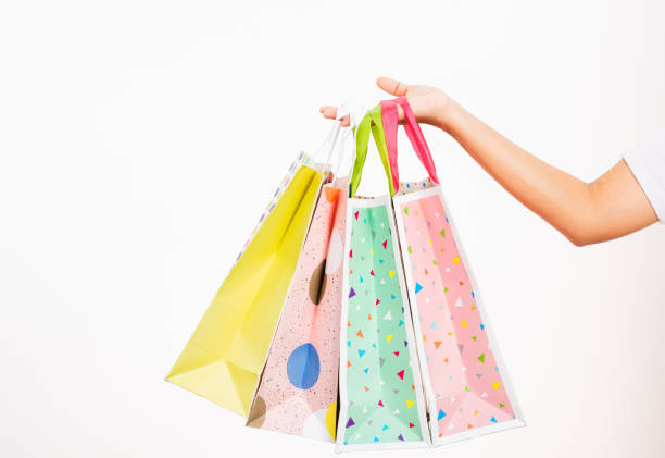 istock women hand holding colorful multicolor shopping bag many packets 1290939267
