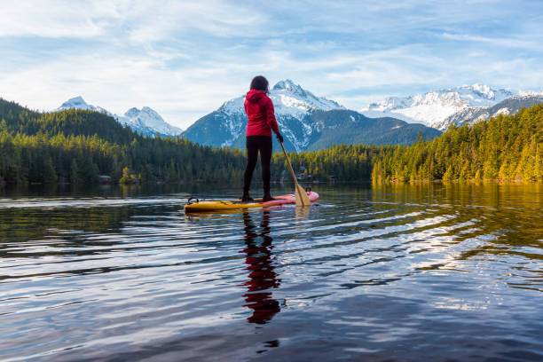 istock Adventurous Girl Paddle Boarding on Levette Lak 1290942224