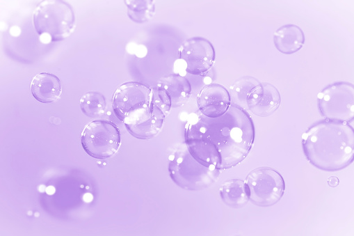Beautiful transparent purple bubbles background.