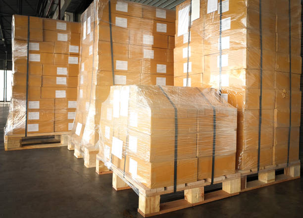 istock Shipment boxes. cargo export. Stacked of cardboard boxes on pallet rack at the warehouse storage. warehouse logistics. 1290956443