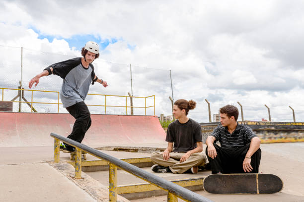 istock Young man performing maneuver on a skate park 1290963212