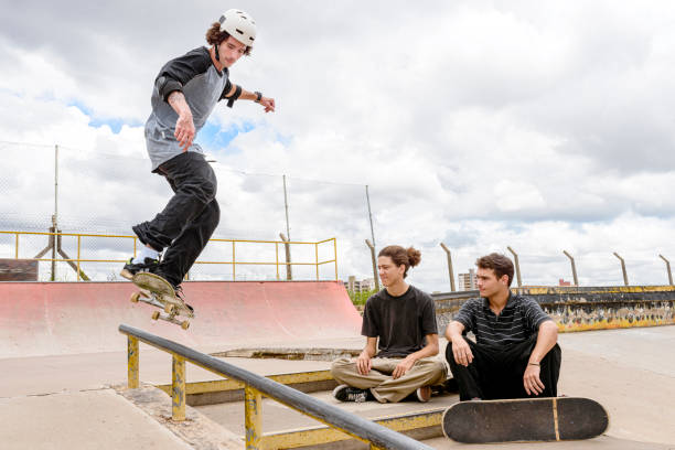 istock Boy performing maneuver on skatepark track 1290963216