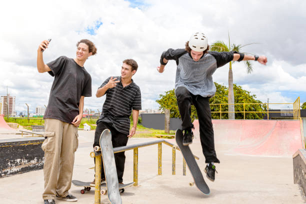 istock Young man with protective equipment performing maneuver between friends. 1290963218