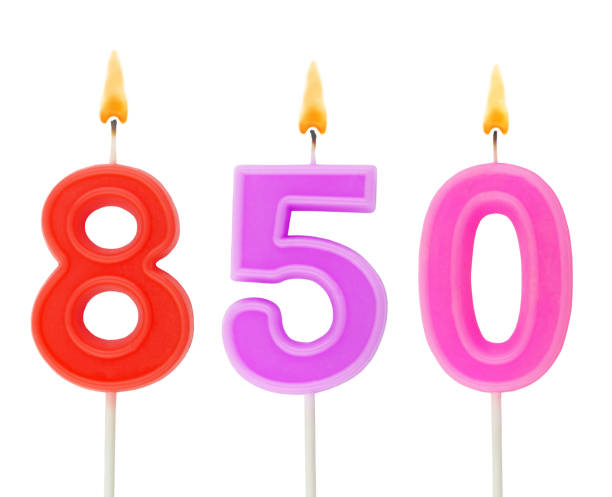istock Burning birthday candle isolated on white, number 850 1290964135
