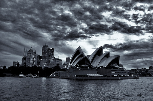 Sydney, New South Wales, Australia, April 21, 2017: Photographed from a Ferry in Sydney Harbour the Sydney Skyline at Night, with the Sydney Opera House.