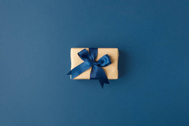 istock Blue theme craft gift box present with classic blue ribbon and copy space, holiday, xmas, christmas 2020. Shopping, sale banner, flyer, coupon concept, father, dad day, birthday, valentine, wedding 1290966778