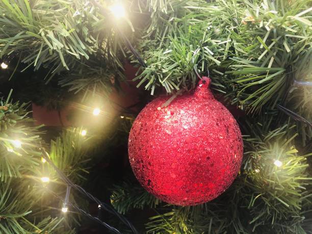 istock Christmas tree decorated with red, ball and yellow lights 1290967462