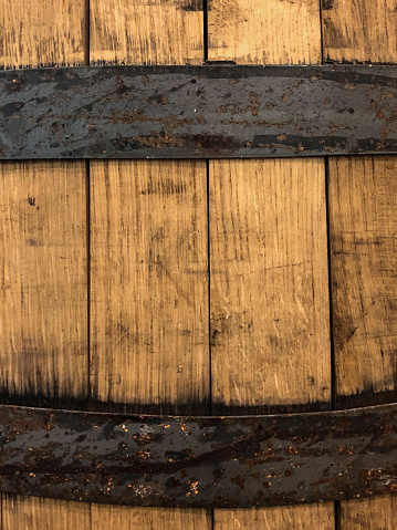 This unique background consists of a wooden barrel with metal strips.  The brown wood grain on the barrel is beautiful.