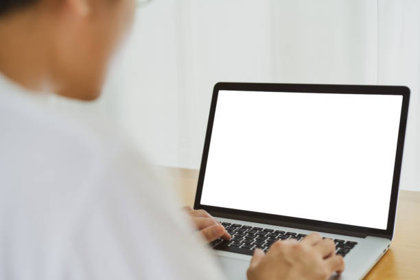 istock Asian businessman working on laptop computer, mock up laptop. 1290971426