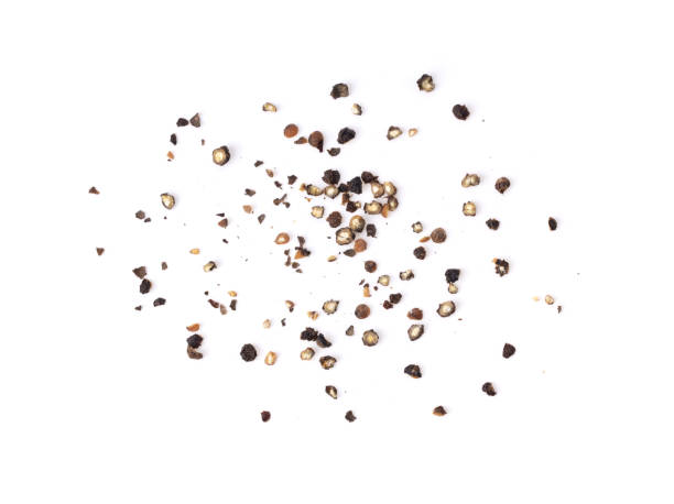 Ground black pepper on a white background top view Ground black pepper isolated on a white background top view black peppercorn photos stock pictures, royalty-free photos & images