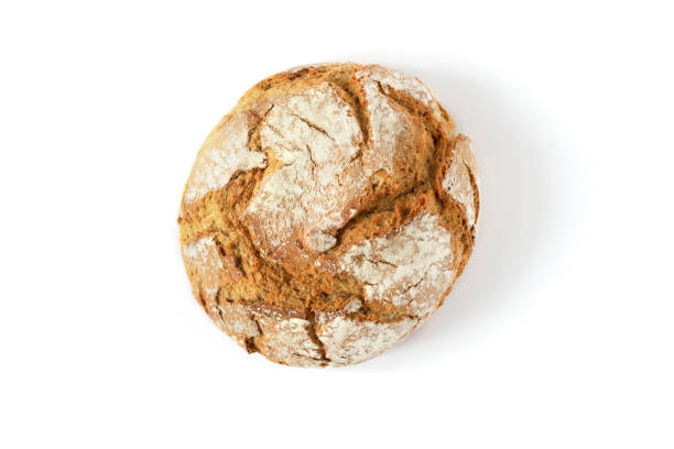 istock Round loaf of oat bread isolated on white background top view. 1290972248