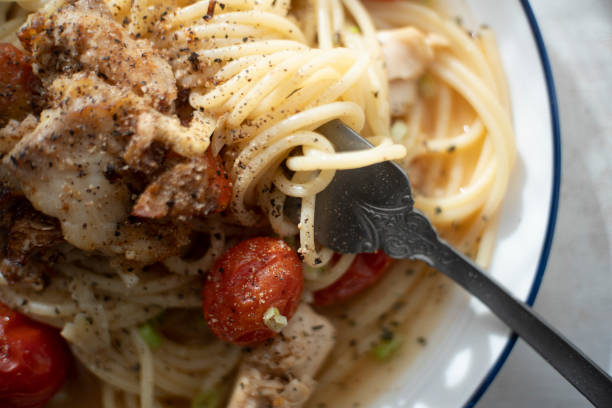 istock homemade spaghetti, cooked with sole fish and tomato 1290972367