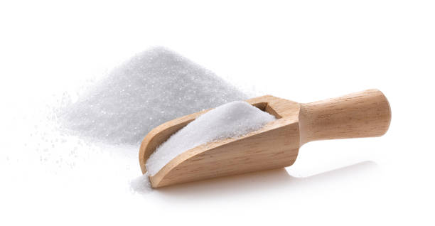 istock salt in wood scoop  isolated on white background 1290974905