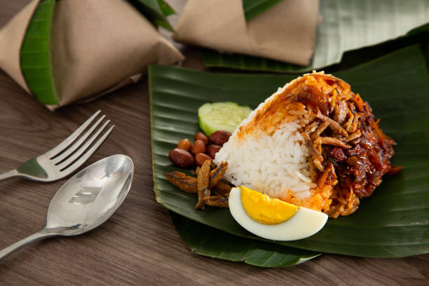 istock Nasi lemak pack in banana leaf, popular breakfast in Malaysia 1290975110