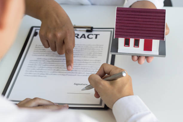 istock The buyer is signing a property purchase agreement. 1290976360