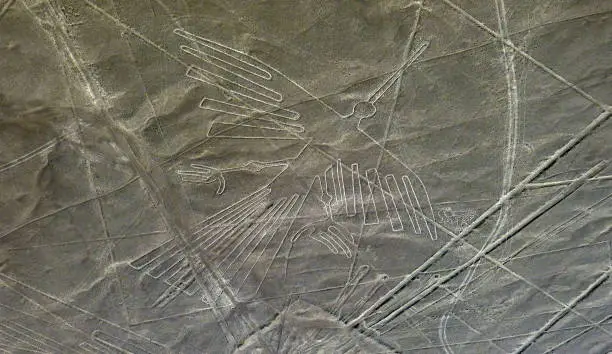 Photo of Nazca Lines Geoglyph Condor bird Peru desert Nasca valley South America mystical drawings on Earth soil. Mysterious Nazca culture, Ancient Nasca civilization.