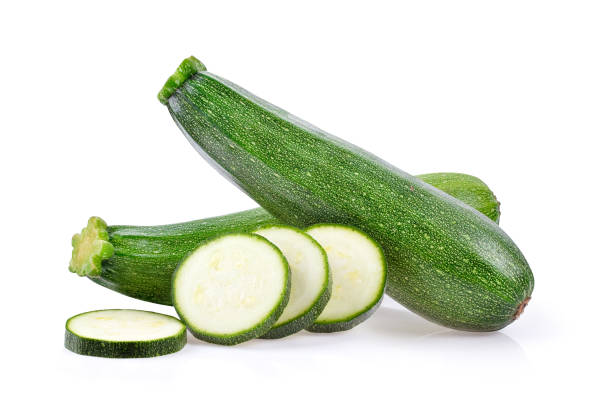 istock fresh green zucchini with slice on white background 1290979974