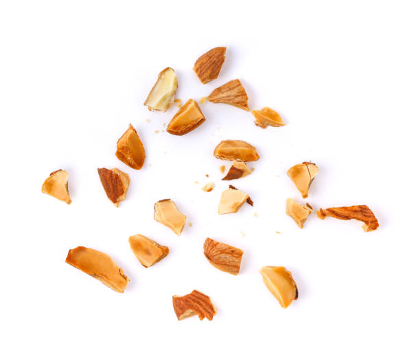istock Pieces of almonds on white background 1290980037