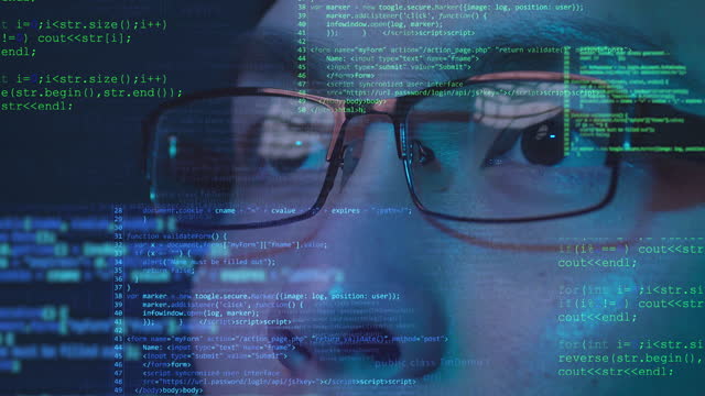 Asian Chinese man smart fintech programmer wear glasses looking on futuristic computer coding, future artificial intelligence big data technology concept.