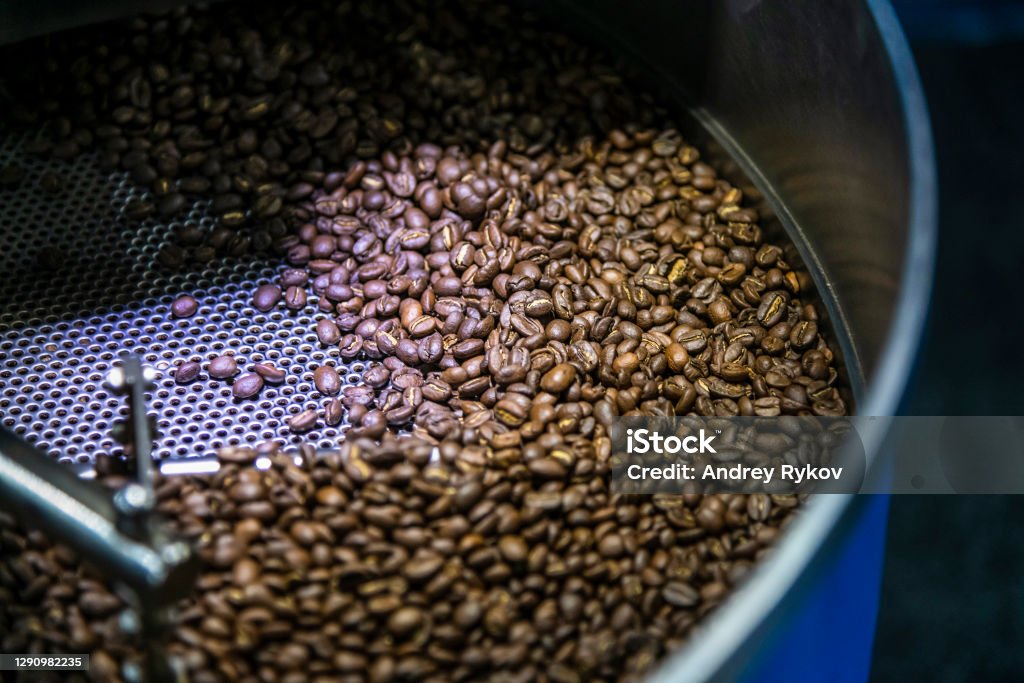 Coffee bean roaster Coffee bean roaster. Selective focus. Close up view on brown coffee beans. Freshly roasted coffee theme. Coffee Roaster Stock Photo