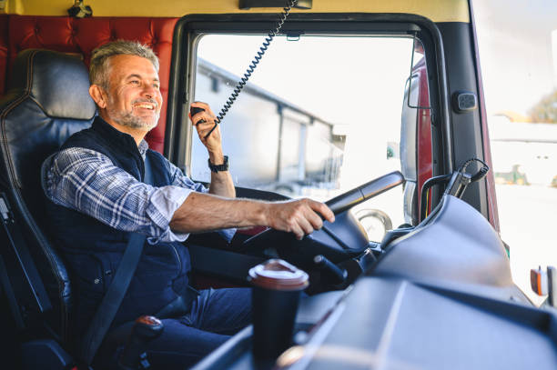istock Mature truck driver CB talking 1290982635