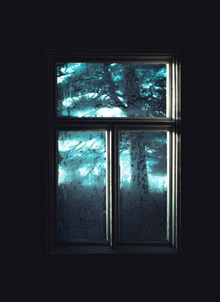 istock Old frozen window and mystical light. 1290982714