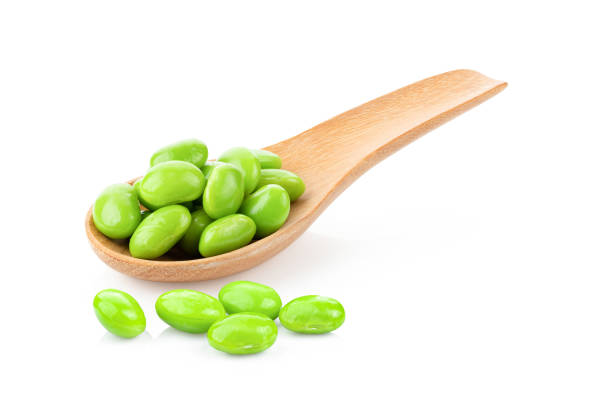 istock green soybeans in wood spoon isolated on white 1290982878