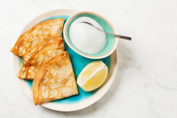 istock Shrove Tuesday pancakes with lemon 1290984432