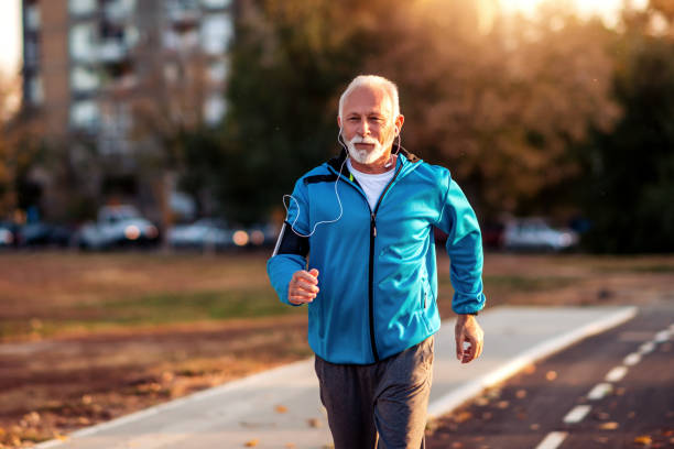 istock Senior man jogging outdoors in the city 1290985483