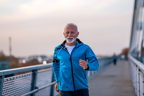 Senior man jogging outdoors in the city.Concept of healthy lifestyle.