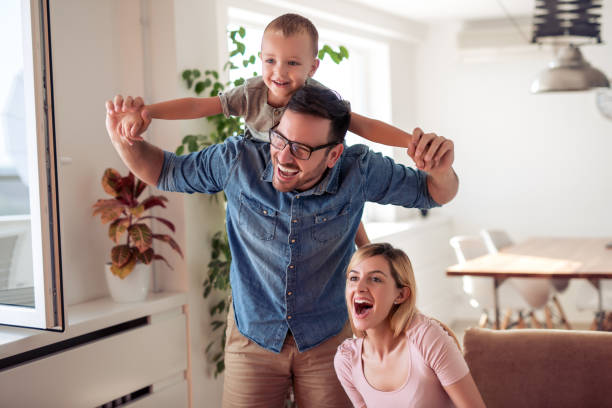 istock Happy family enjoying at home 1290994024