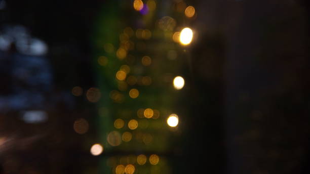 istock Blurry Light at Night with raind drop at transpatent plastic wall for christmas, valentine or new year video background, wallpaper, backdrop etc 1290994221