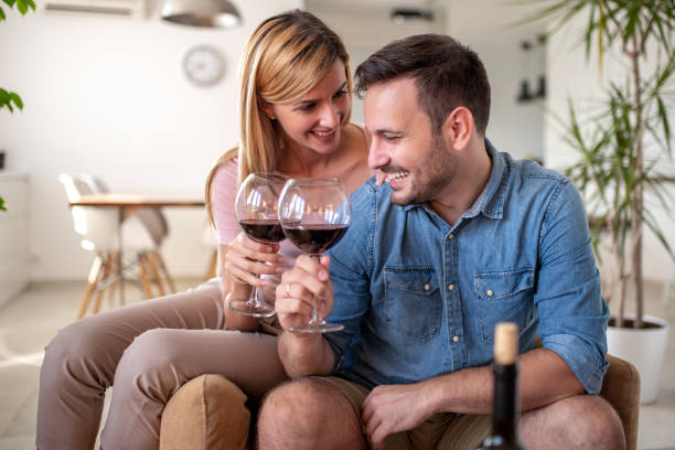 istock Couple celebrating at home 1290994256
