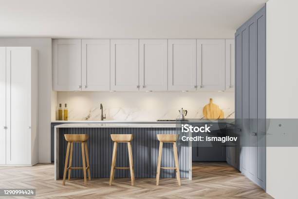 Modern White And Gray Kitchen With Bar Stock Photo - Download Image Now - Kitchen, Modern, Cabinet