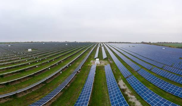 istock Fly over a renewable solar power plant with sun in Ukraine 1290997705