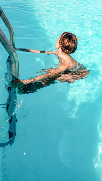 istock The child bathes in the pool. 1290998991