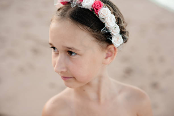 istock A child's face with a red and white headband. 1290999070