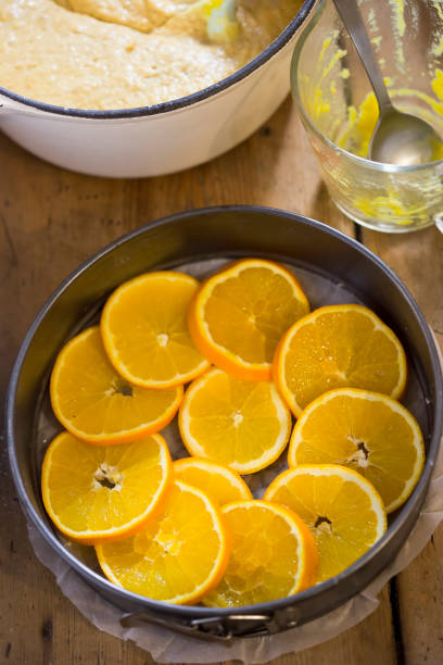 istock Sliced oranges in baking form with pastry dough 1290999086